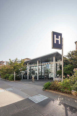 Hospital sign in front of the entrance to the Saint-Joseph Hospital in Paris.