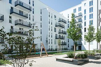 Inner courtyard with playground in the Tassiloplatz residential neighbourhood in Munich.