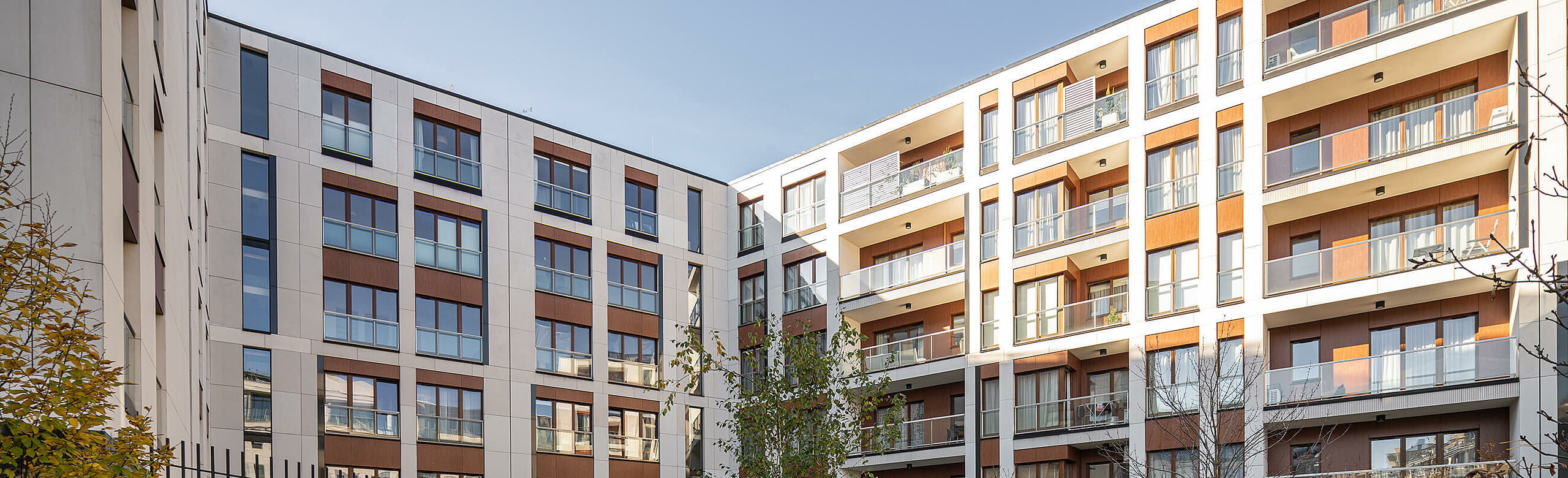 View of the façade with balconies of the Piano House residential building in Warsaw 
