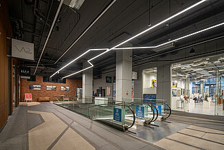 Interior view with escalators of the Koneser Cultural Centre in Warsaw.