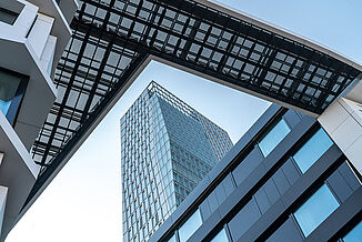View from below of a building section with transition to another building from the Palais Quartier in Frankfurt.