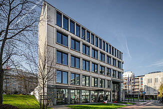 Front view with entrance of the modern Carpathia office building in Warsaw's Powiślethia district.