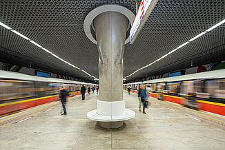 Trains arriving at the Rondo One metro station in Warsaw.