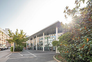 Side view of the glass front of the entrance area of the Saint-Joseph hospital in Paris.