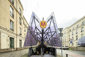 Metro entrance with a purple coloured glass roof in Warsaw.