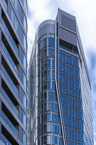 Glazed façade of The Four tower blocks in Frankfurt.