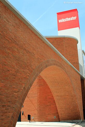 Brick wall with round arch from the Volkstheater Munich.