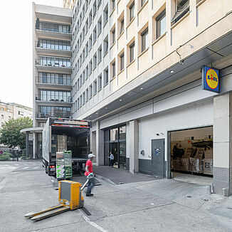 Delivery to a Lidl supermarket in a mixed-use building in Paris.