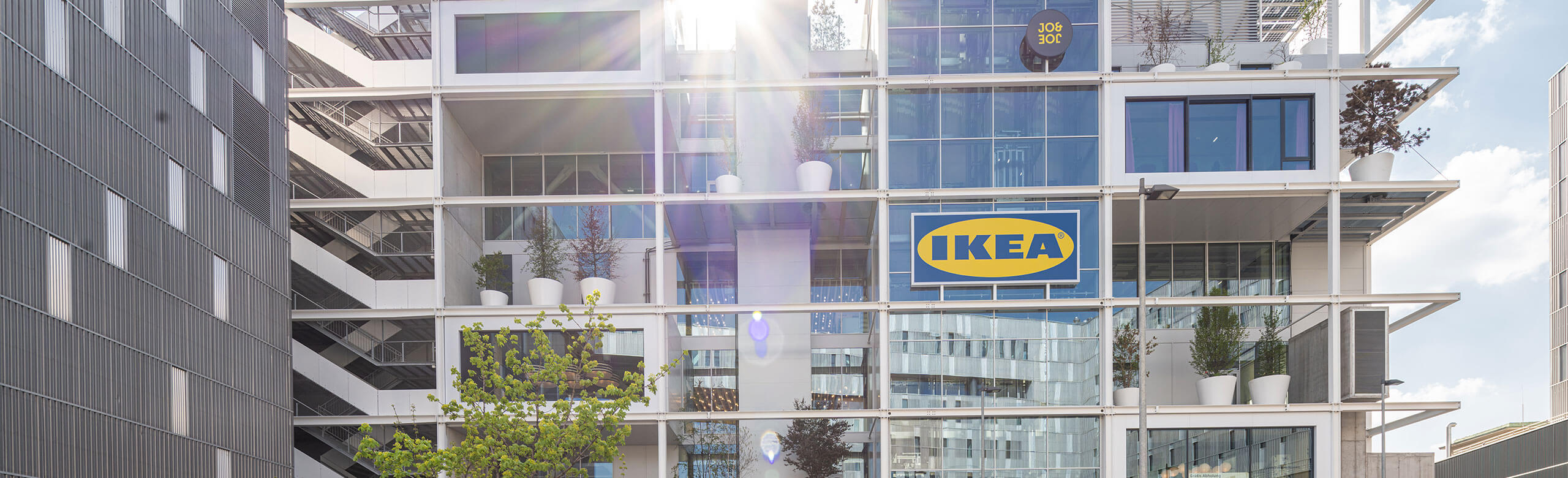 Exterior view with balconies and stairs of Ikea Westbahnhof in Vienna.